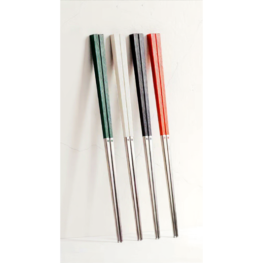Four pairs of Radiko premium 316 stainless steel chopsticks standing vertically against a white wall, showcasing the laser-engraved handles in dark green, cream white, sleek black, and vibrant red