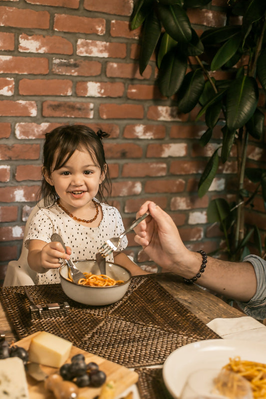304 stainless steel kiddo flatware rest holding child-sized utensils during a toddler’s mealtime – Radiko