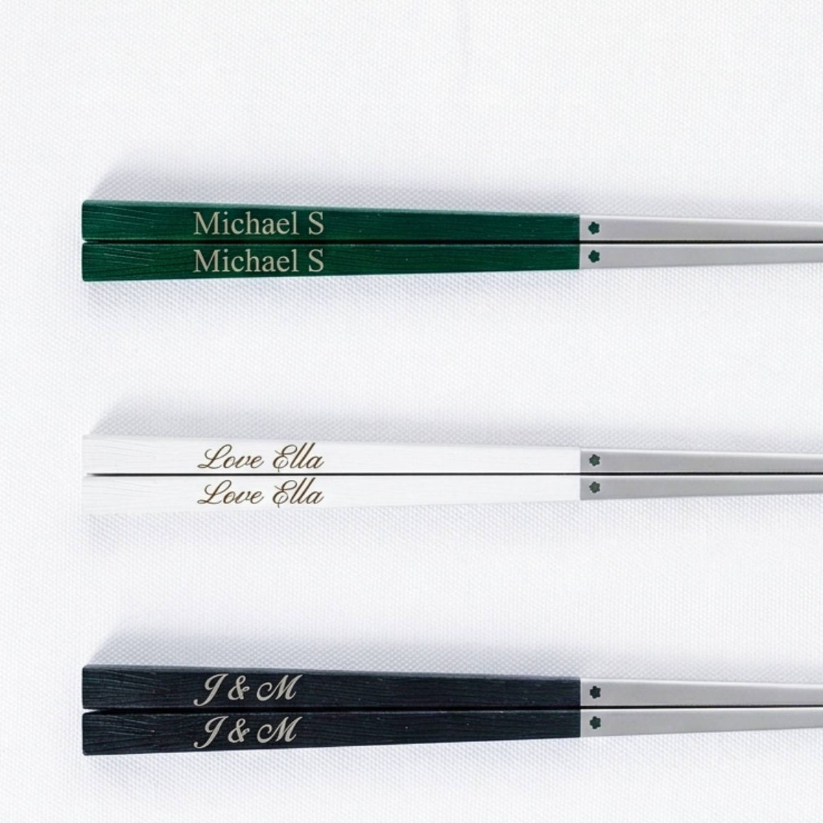 Sample engraving preview on green, white, and black 316 stainless steel chopsticks