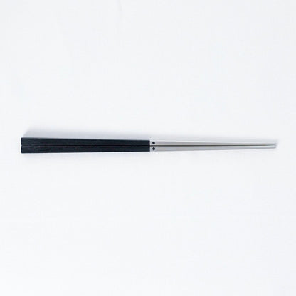 Radiko 316 stainless steel chopsticks with wood-grain handles in black, on a white background