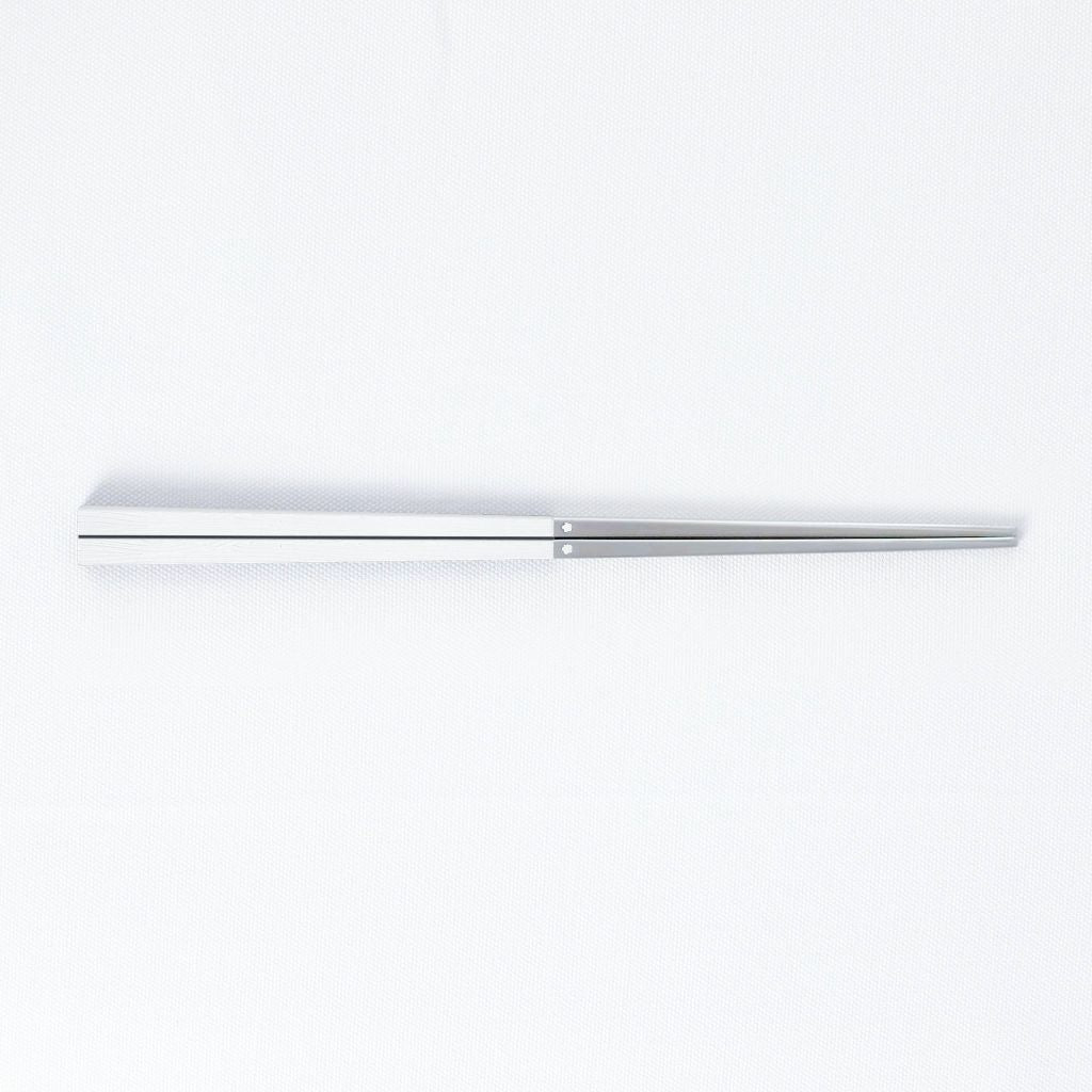 Radiko 316 stainless steel chopsticks with wood-grain handles in white, on a white background