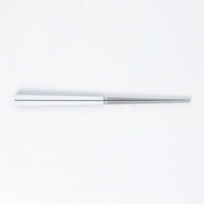 Radiko 316 stainless steel chopsticks with wood-grain handles in white, on a white background