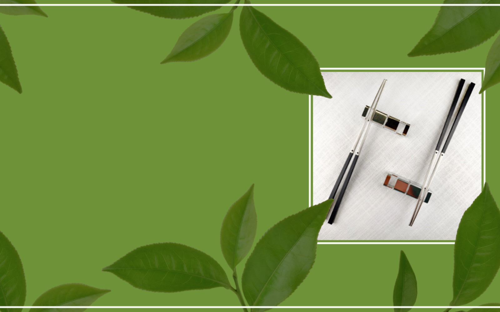 An elevated flat-lay photograph showing Radiko's reusable 316 Stainless Steel chopsticks resting on 304 Steel chopstick rest, presented on a light textured linen napkin. The scene is framed by a border of vibrant green tea leaves, presenting a clean and sustainable tableware option for Earth Month.