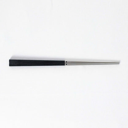 Radiko 316 stainless steel chopsticks in black with wood-grain textured square handles and metallic silver tips.
