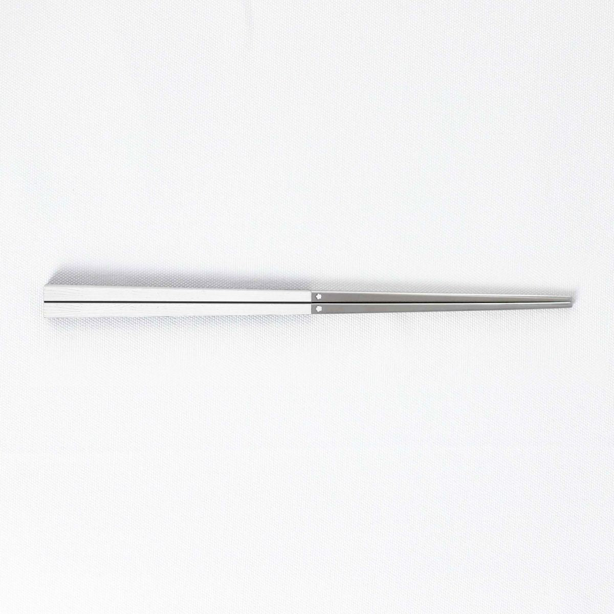 Radiko 316 stainless steel chopsticks in white with wood-grain textured square handles and metallic silver tips.