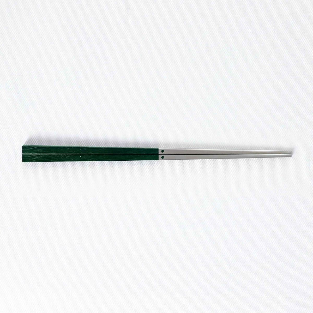 Radiko 316 stainless steel chopsticks in dark green with wood-grain textured square handles and metallic silver tips.