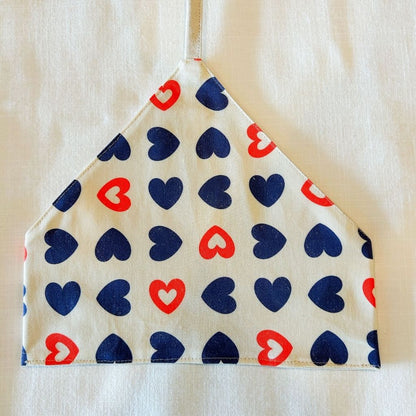 utensil wrap with red and blue heart pattern on a beige background